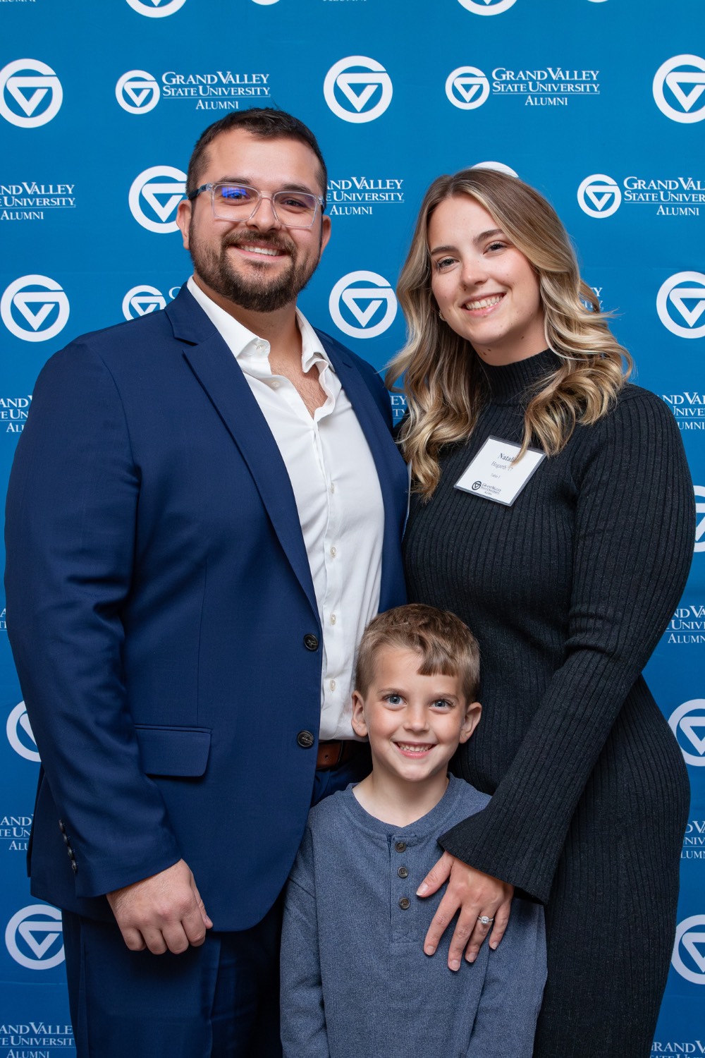 Alex Hogarth with wife and child vertical